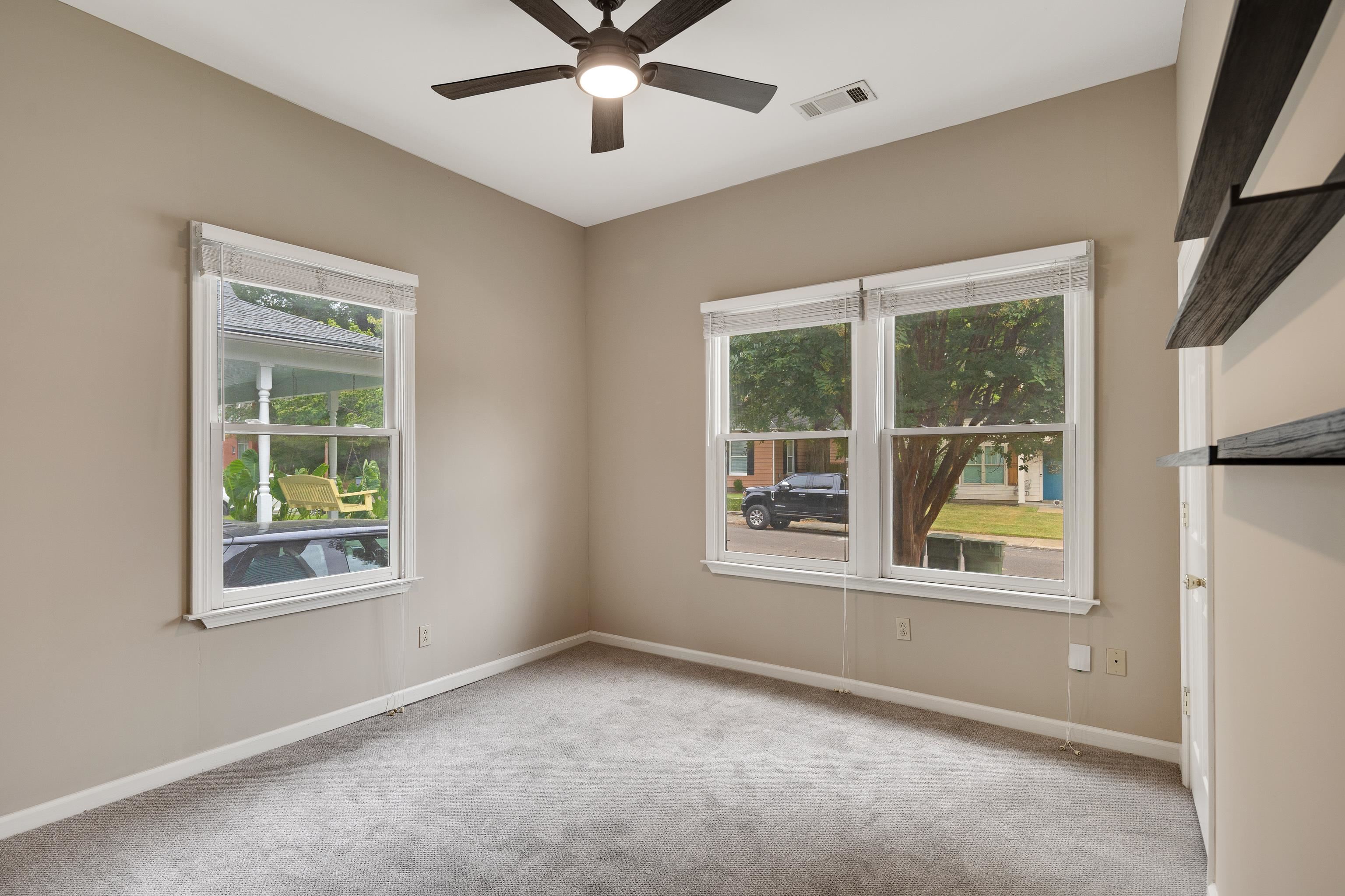 1003 New York Street Memphis, TN 38104 - Photo 22 of 40 an empty room with a window and ceiling fan