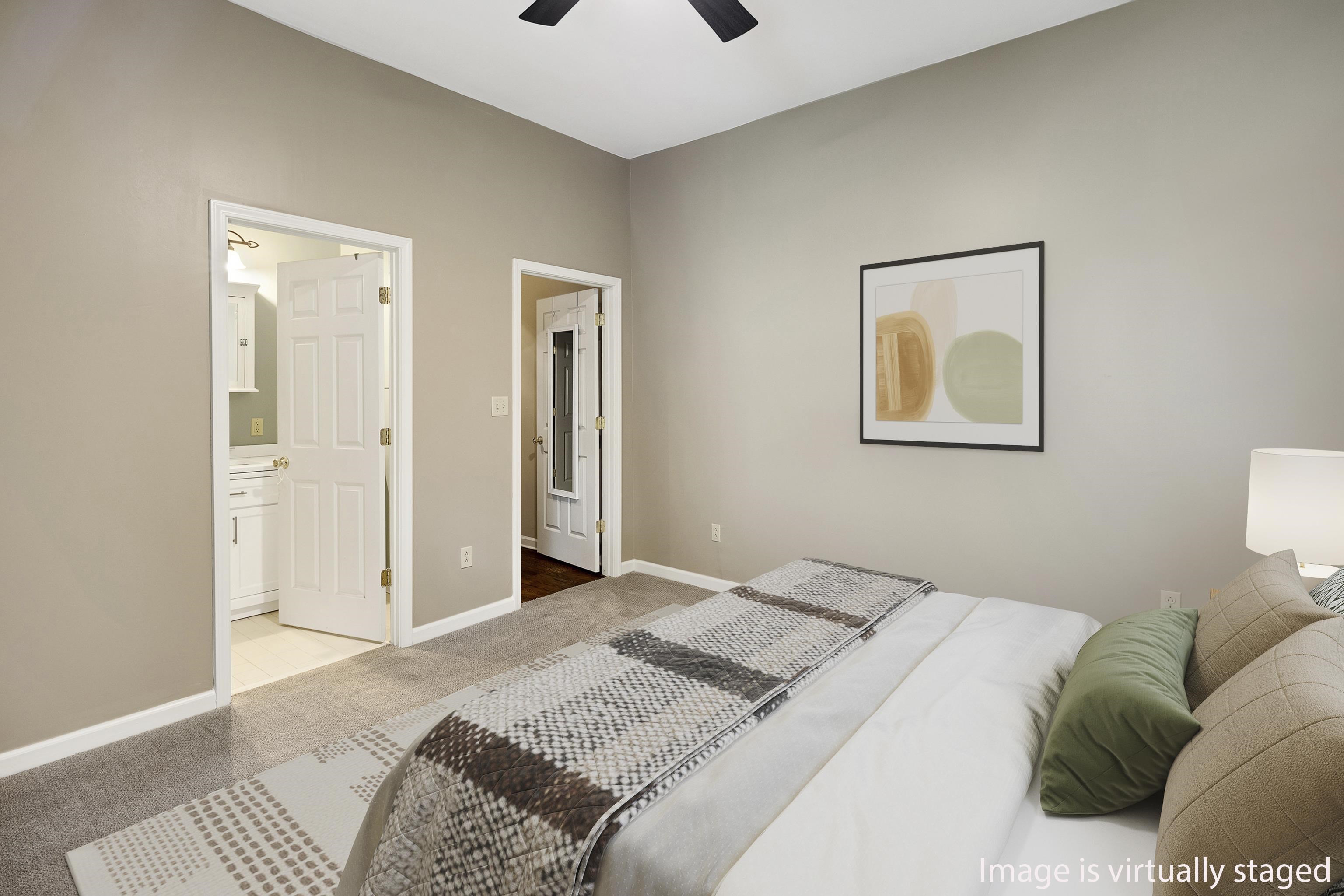 1003 New York Street Memphis, TN 38104 - Photo 28 of 40 a bedroom with a bed and a painting on the wall