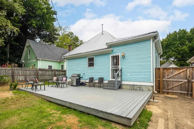 a view of a patio with swimming pool table and chairs