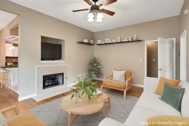 a living room with furniture fireplace and a flat screen tv