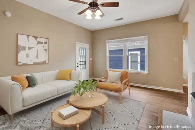 a living room with furniture and a window