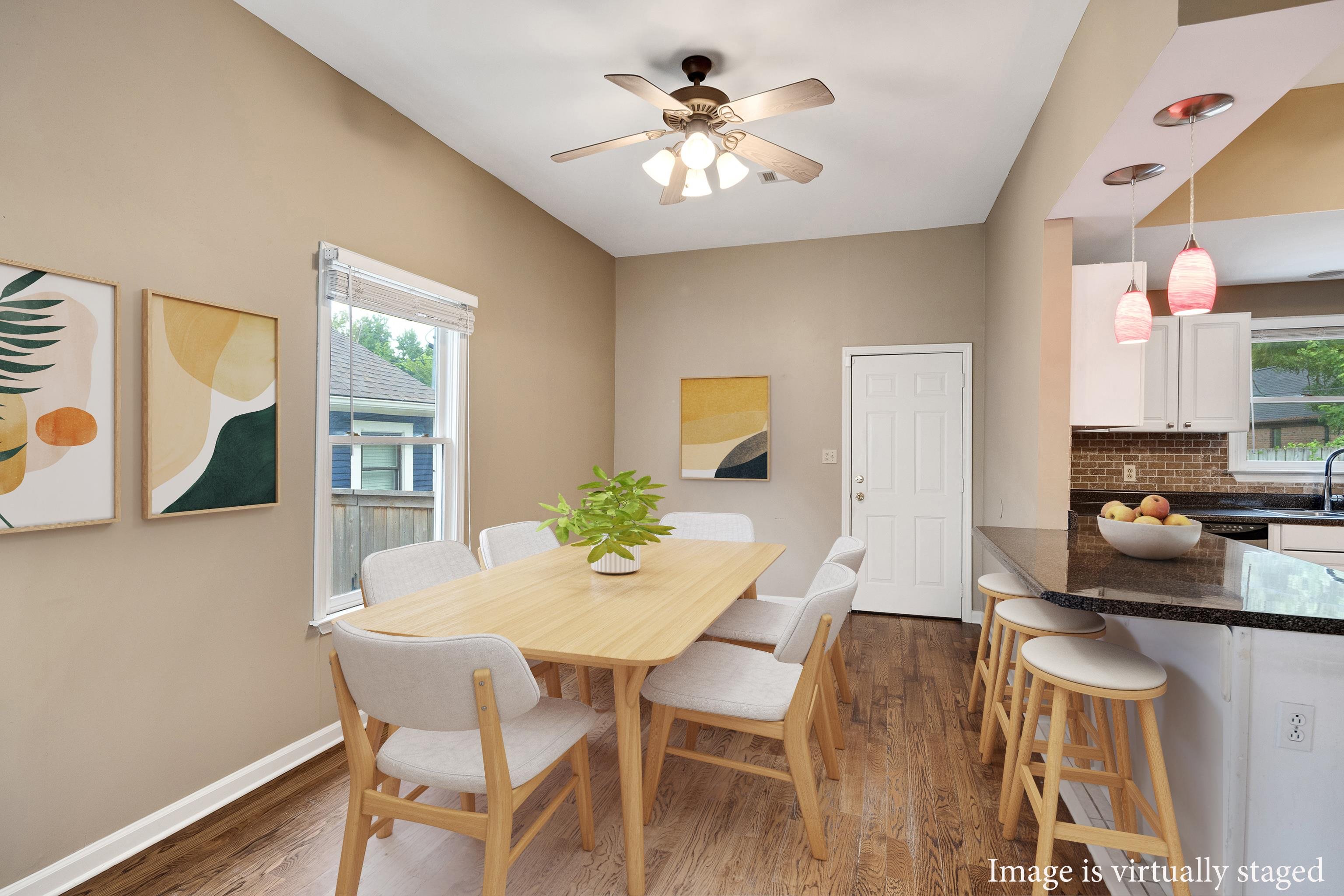 1003 New York Street Memphis, TN 38104 - Photo 10 of 40 a view of a dining room with furniture and a potted plant