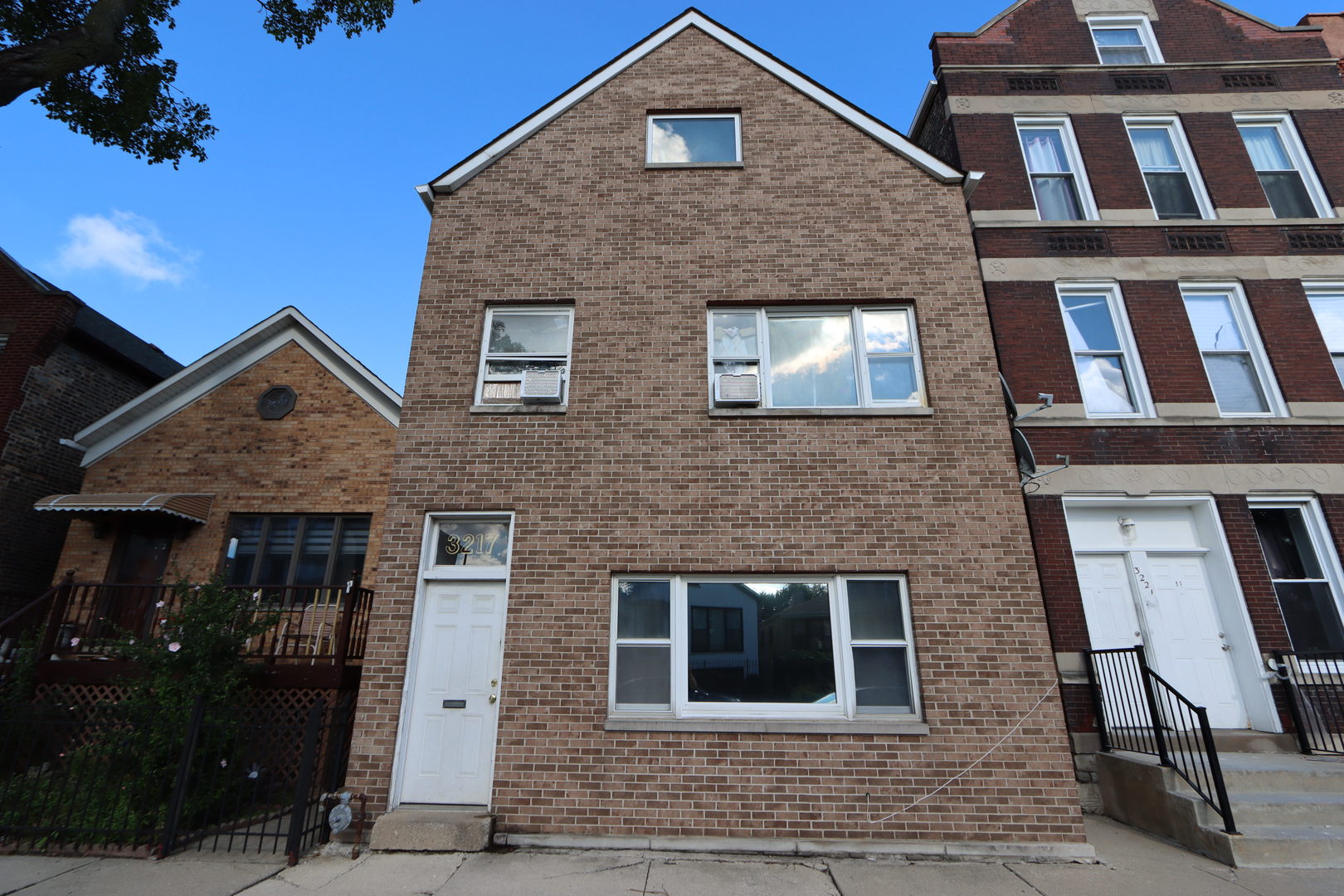 3217 South May Street Chicago, IL 60608 - Photo 1 of 27 a front view of a house