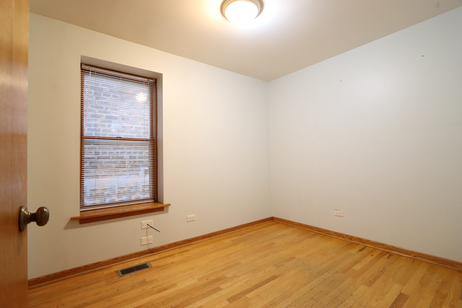 3217 South May Street Chicago, IL 60608 - Photo 17 of 27 an empty room with a window
