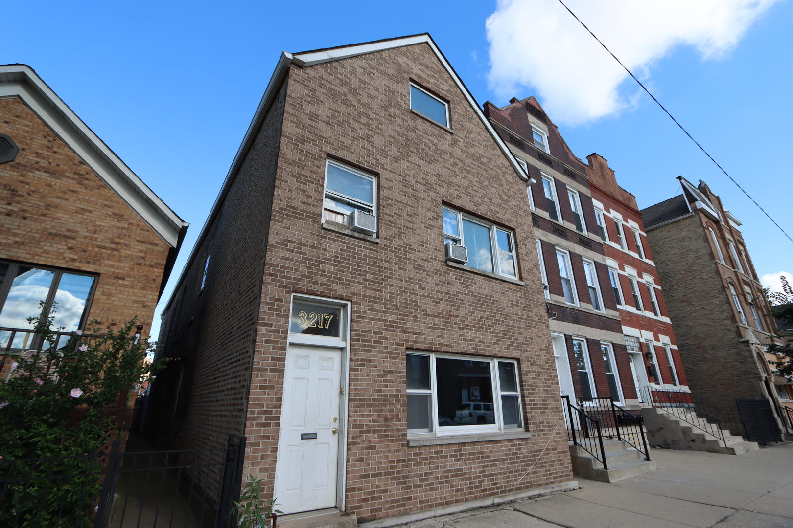 3217 South May Street Chicago, IL 60608 - Photo 2 of 27 a front view of a house