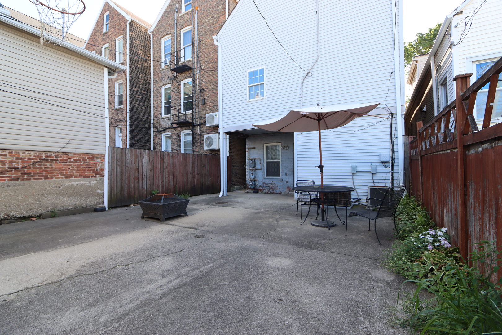 3217 South May Street Chicago, IL 60608 - Photo 25 of 27 a view of a house with backyard and sitting area