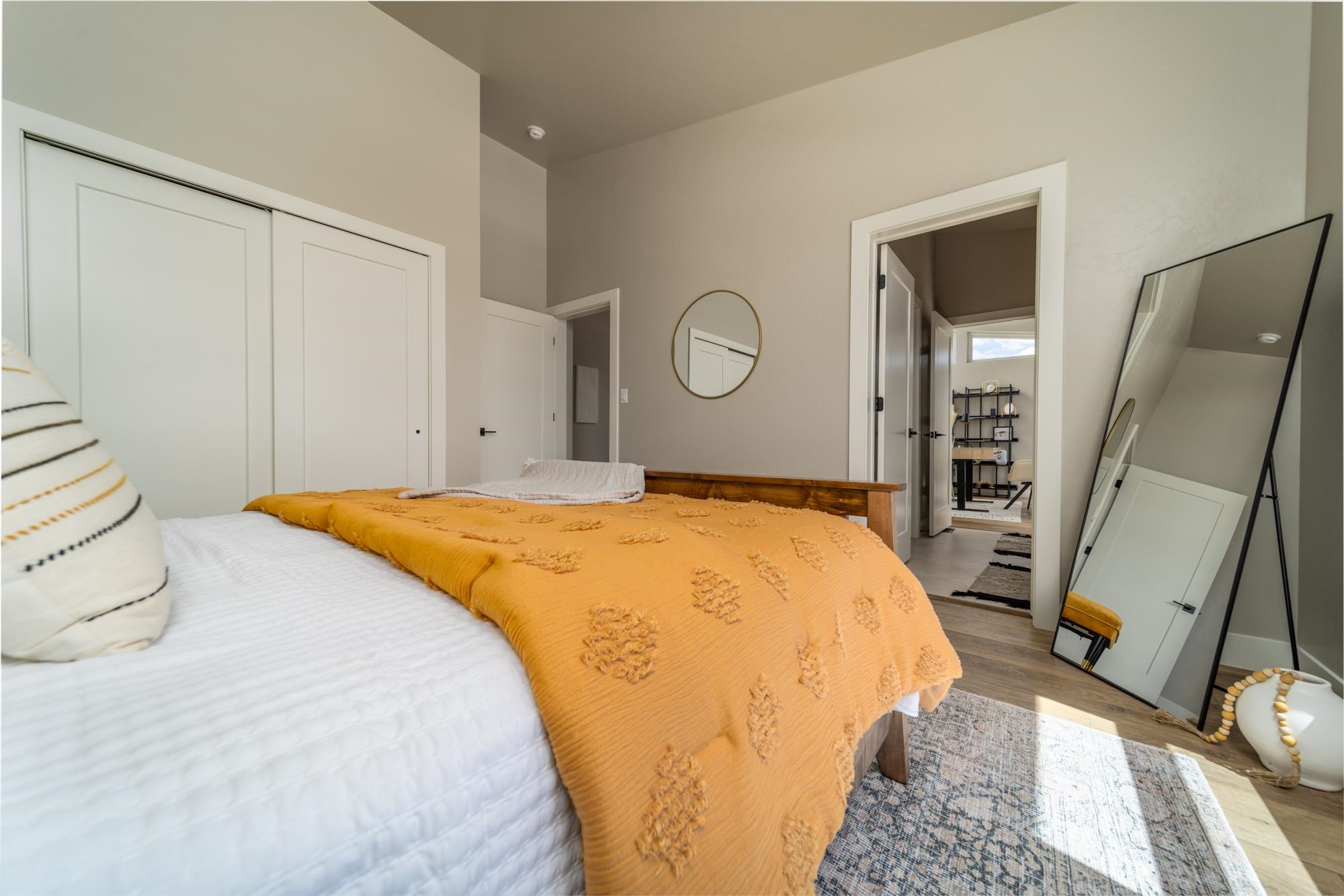 2260 Pyramid Peak Loop Grand Junction, CO 81507 - Photo 18 of 41 a bedroom with a bed and a mirror on the dresser