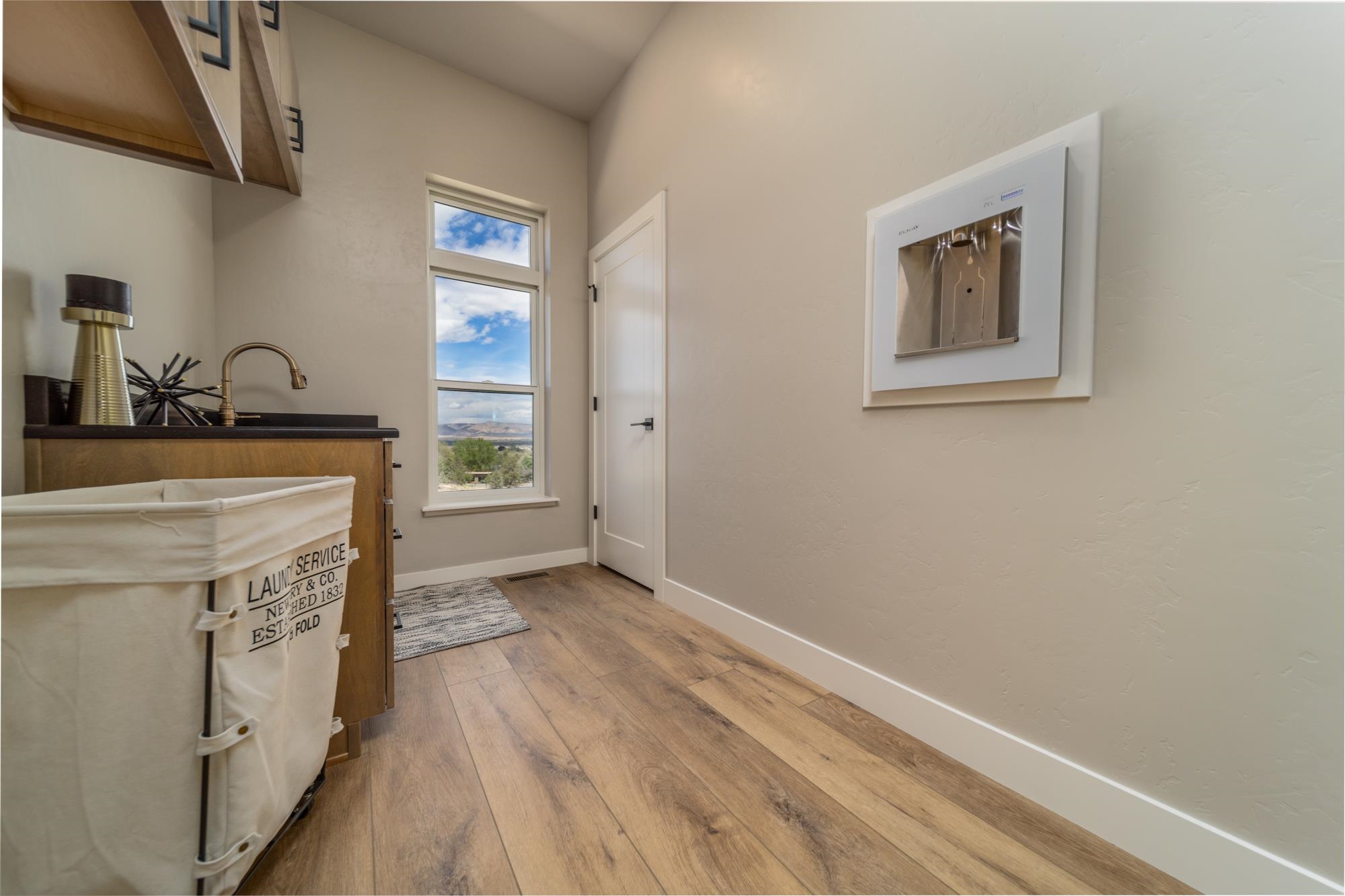 2260 Pyramid Peak Loop Grand Junction, CO 81507 - Photo 29 of 41 a view of a hallway with wooden floor and staircase