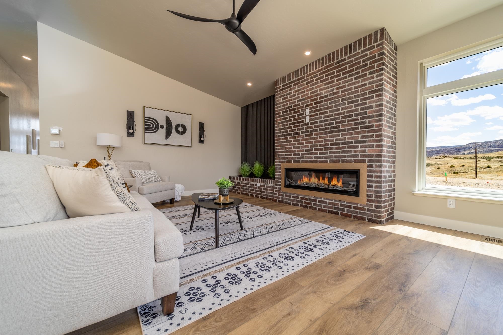 2260 Pyramid Peak Loop Grand Junction, CO 81507 - Photo 7 of 41 a living room with furniture a window and a fireplace