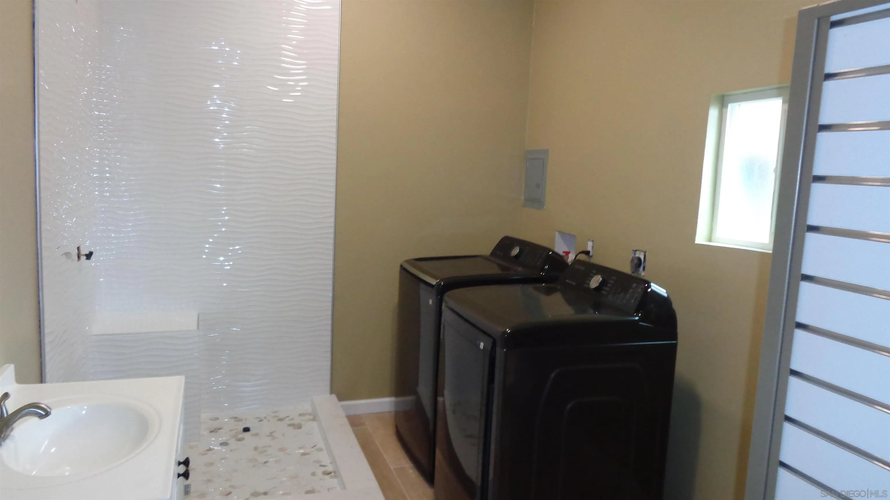 29660 Wilkes Road Valley Center, CA 92082 - Photo 14 of 16 a bathroom with a sink and mirror