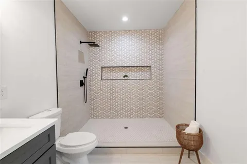 a bathroom with a toilet a sink and bathtub