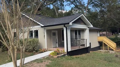 front view of a house with a yard