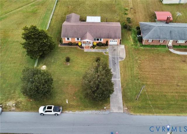 an aerial view of a house with swimming pool