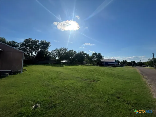 a view of a golf course with a lake