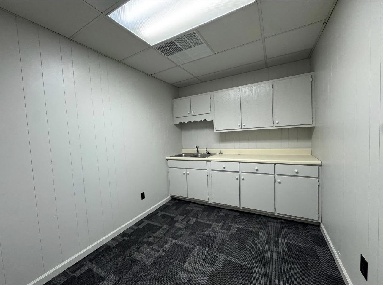 4705 Mueller Brass Road Covington, TN 38019 - Photo 7 of 9 a room with granite countertop white cabinets and sink