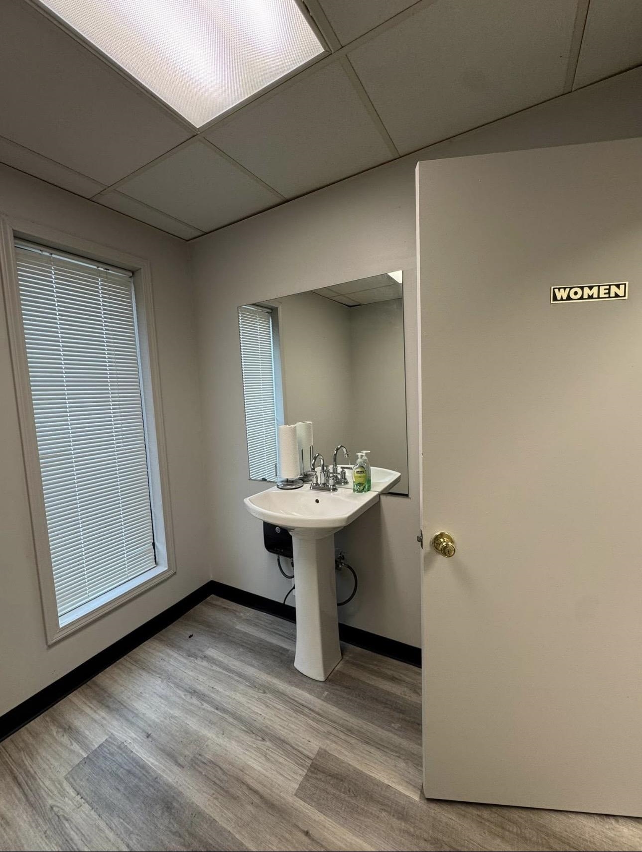 4705 Mueller Brass Road Covington, TN 38019 - Photo 9 of 9 a view of a bathroom with a sink and mirror