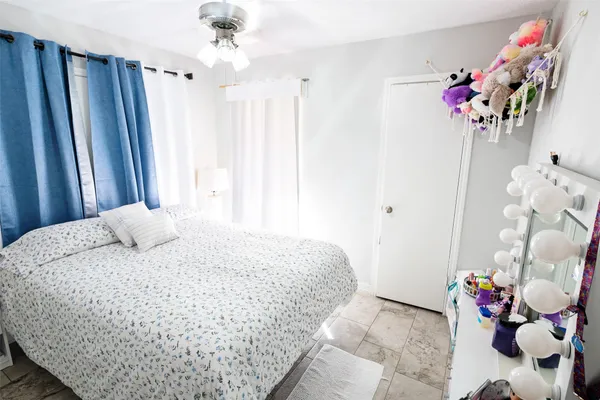 a bed room with a bed and a table