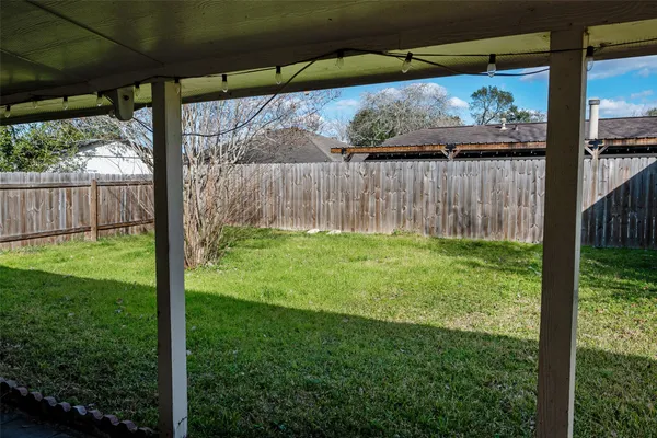 a view of a house with yard and tree s
