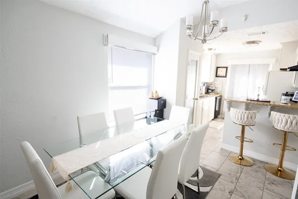 a view of a dining room with furniture