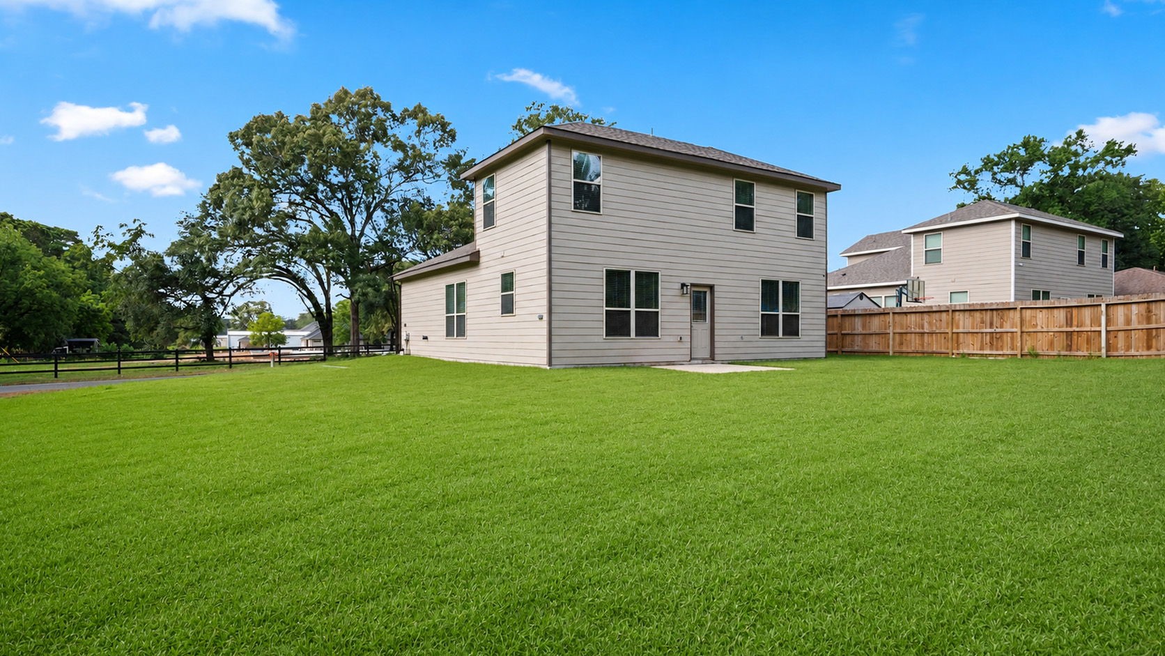 18140 Mail Rte Road Montgomery, TX 77316 - Photo 23 of 26 Enjoy outdoor living with a spacious backyard and patio, offering plenty of room to relax or play.