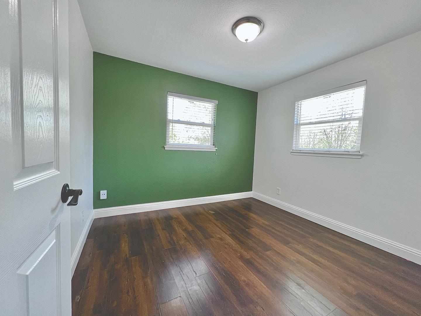 3689 McClellan Drive North Highlands, CA 95660 - Photo 11 of 20 wooden floor in an empty room with a window