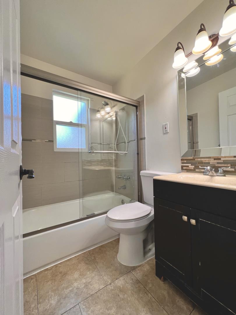 3689 McClellan Drive North Highlands, CA 95660 - Photo 12 of 20 a bathroom with a sink vanity mirror and toilet