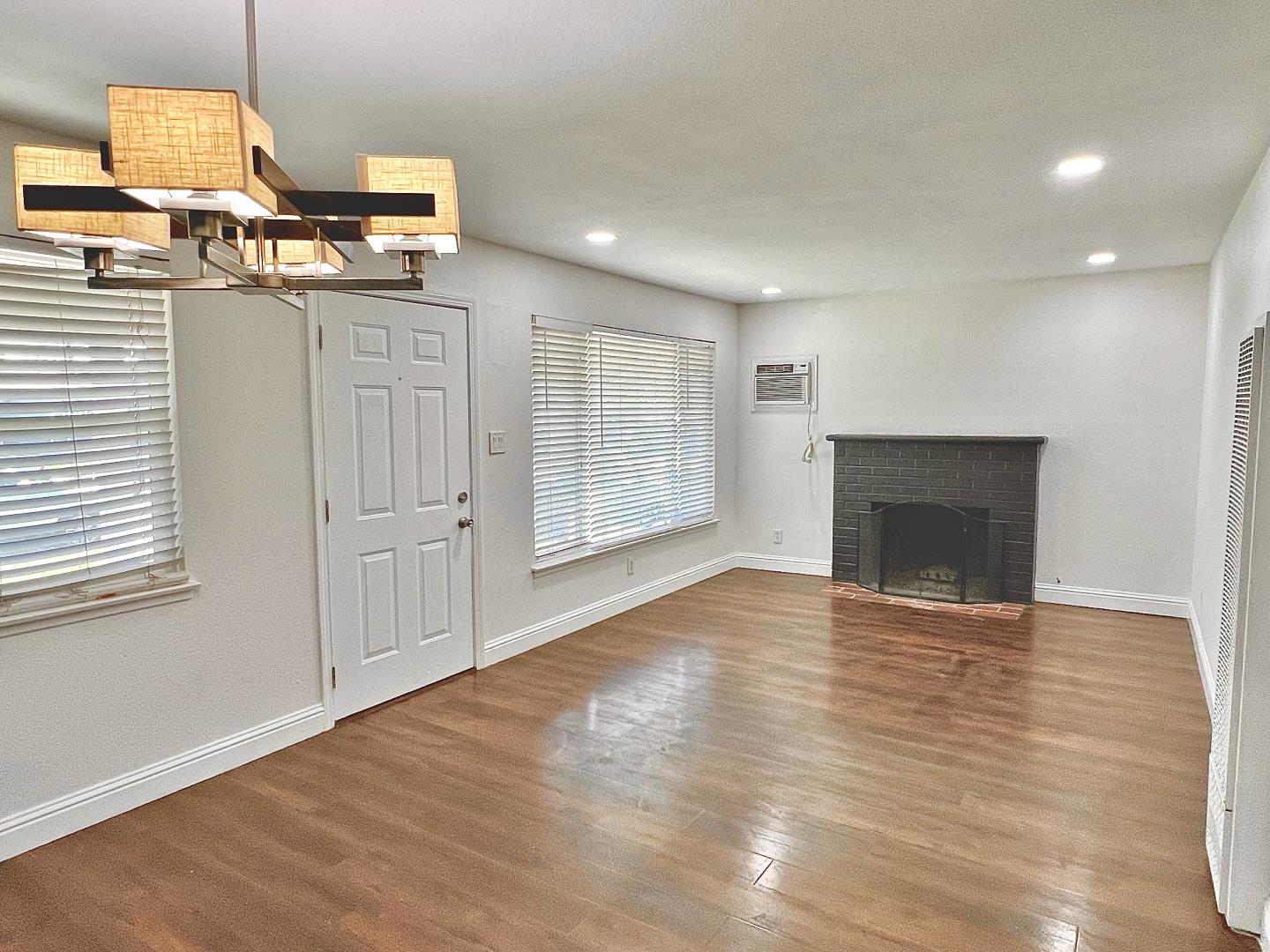 3689 McClellan Drive North Highlands, CA 95660 - Photo 5 of 20 an empty room with windows and fireplace