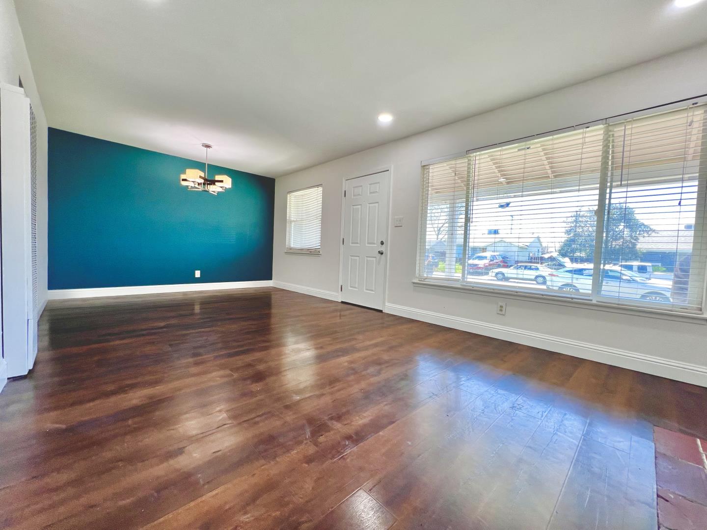 3689 McClellan Drive North Highlands, CA 95660 - Photo 8 of 20 a view of an empty room with wooden floor and a window