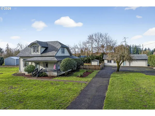 a view of a front of a house with a yard