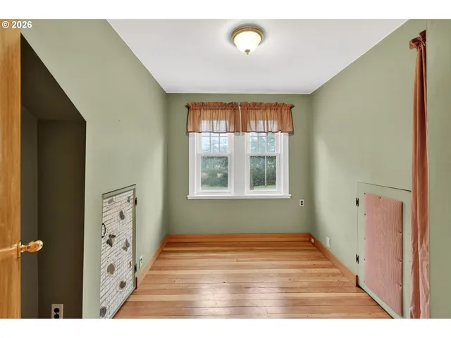 a view of an entryway with wooden floor