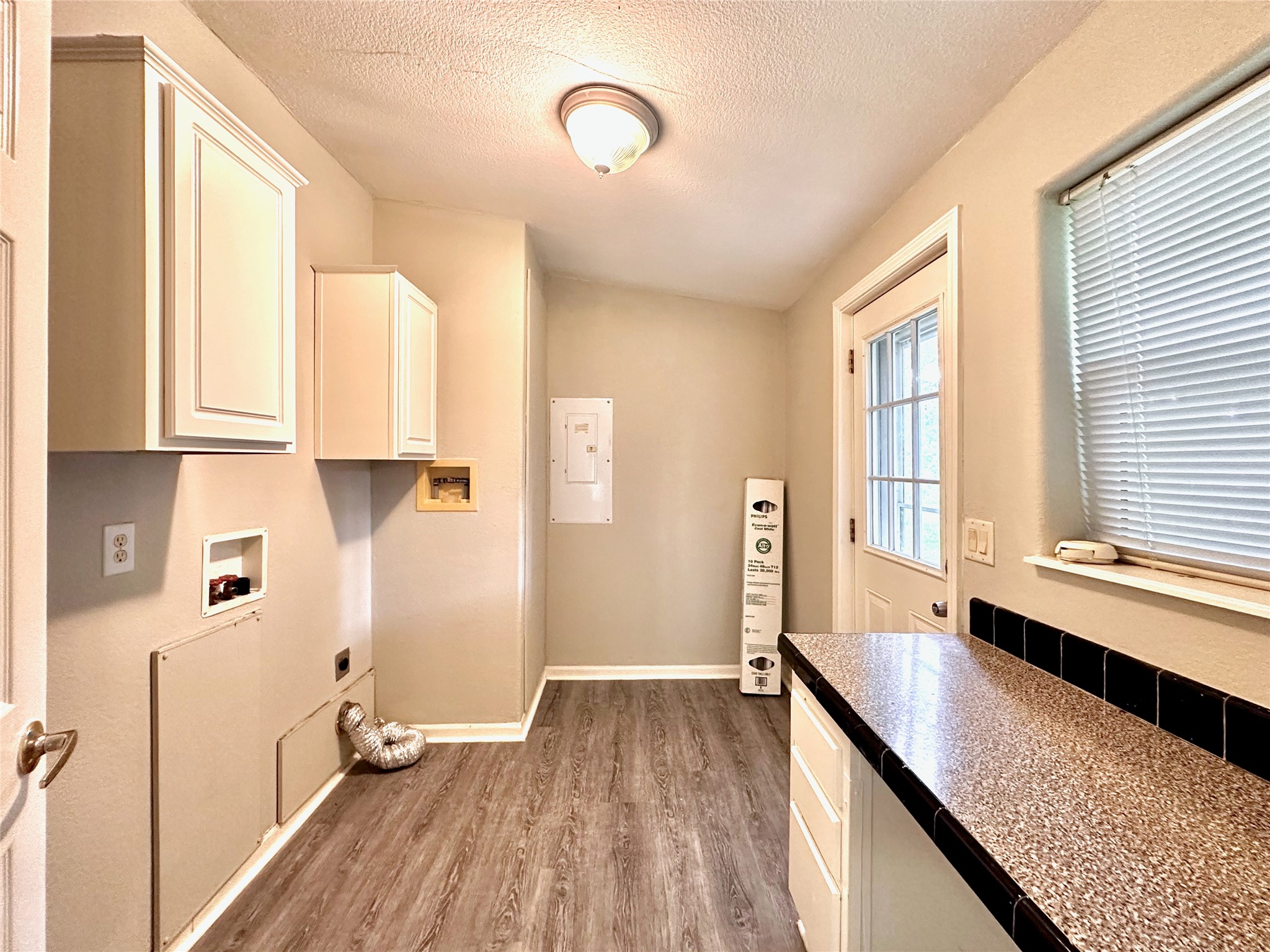 202 Main Street Fresno, TX 77545 - Photo 26 of 26 a view of a kitchen cabinets a stove and wooden floor