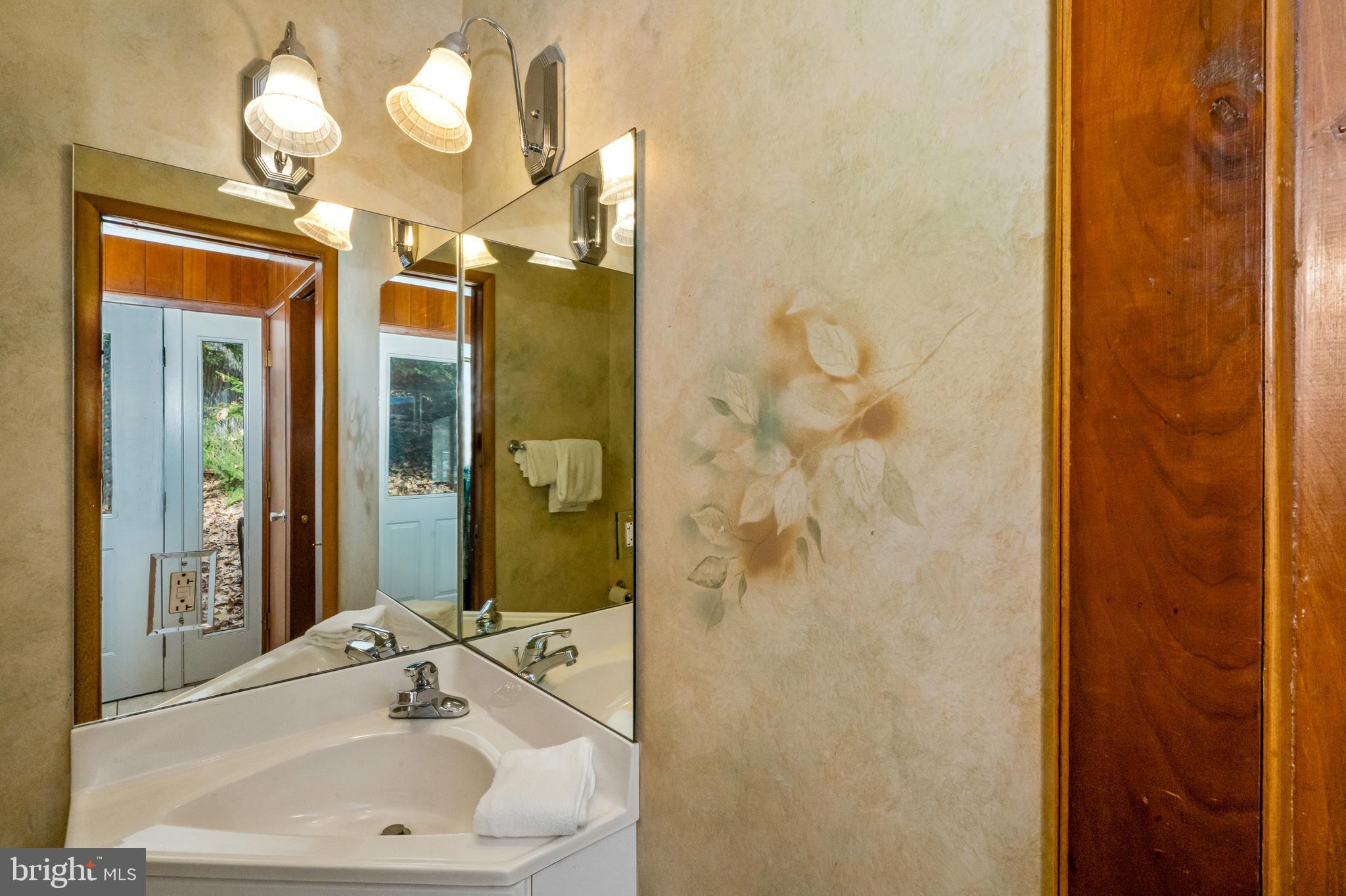 1244 Glendale Road Swanton, MD 21561 - Photo 32 of 52 Main level half bath