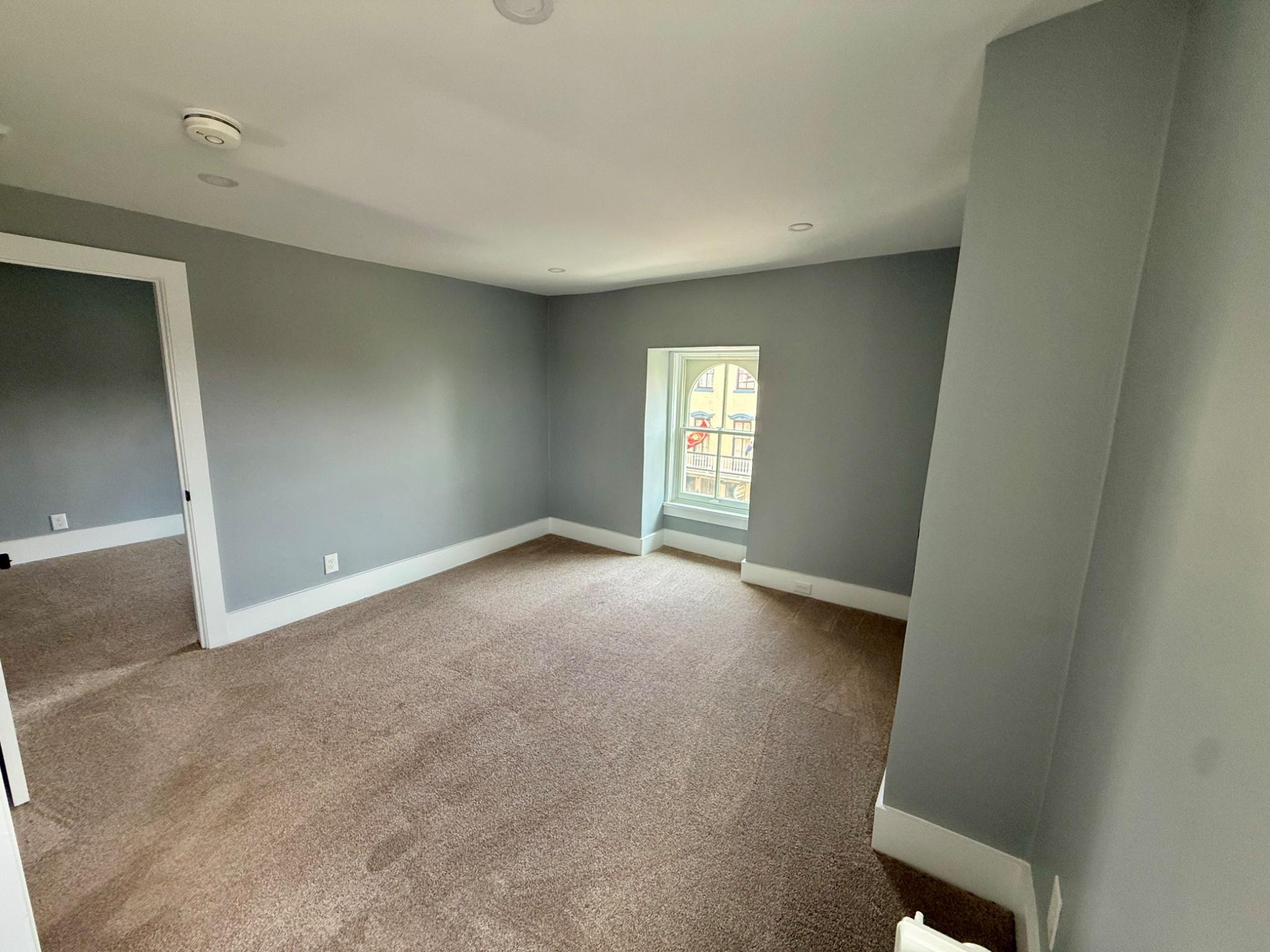 25 West State Street Doylestown, PA 18901 - Photo 5 of 10 Bright & airy living room with plush new carpet.