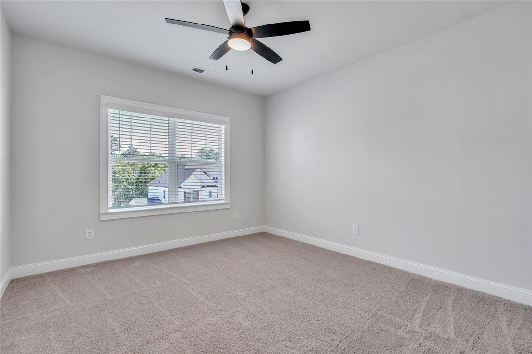 226 Holly Br Road Piedmont, SC 29673 - Photo 29 of 44 Well-lit room offering a quiet retreat with soft carpeting and essential comforts.