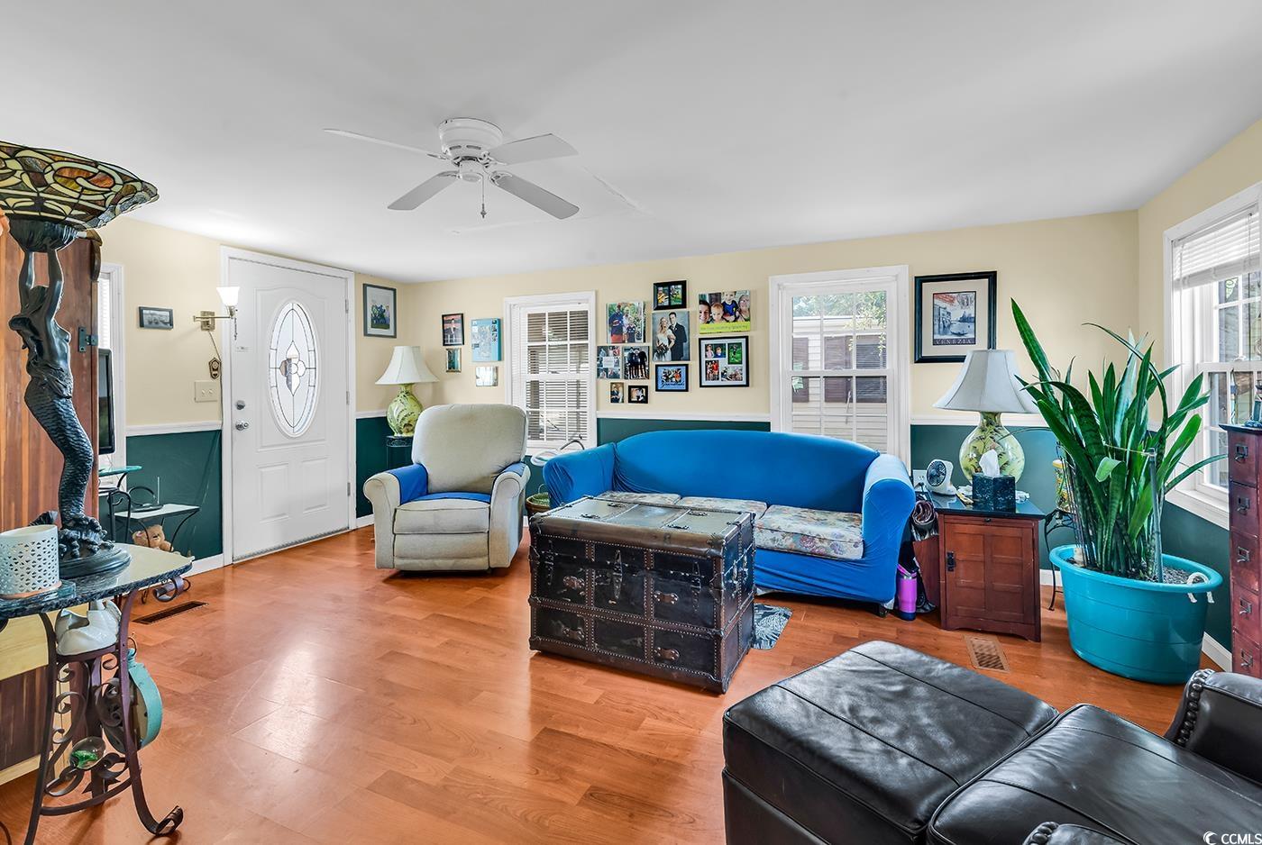 155 Ridgeway Loop Murrells Inlet, SC 29576 - Photo 4 of 31 Living room with a ceiling fan.