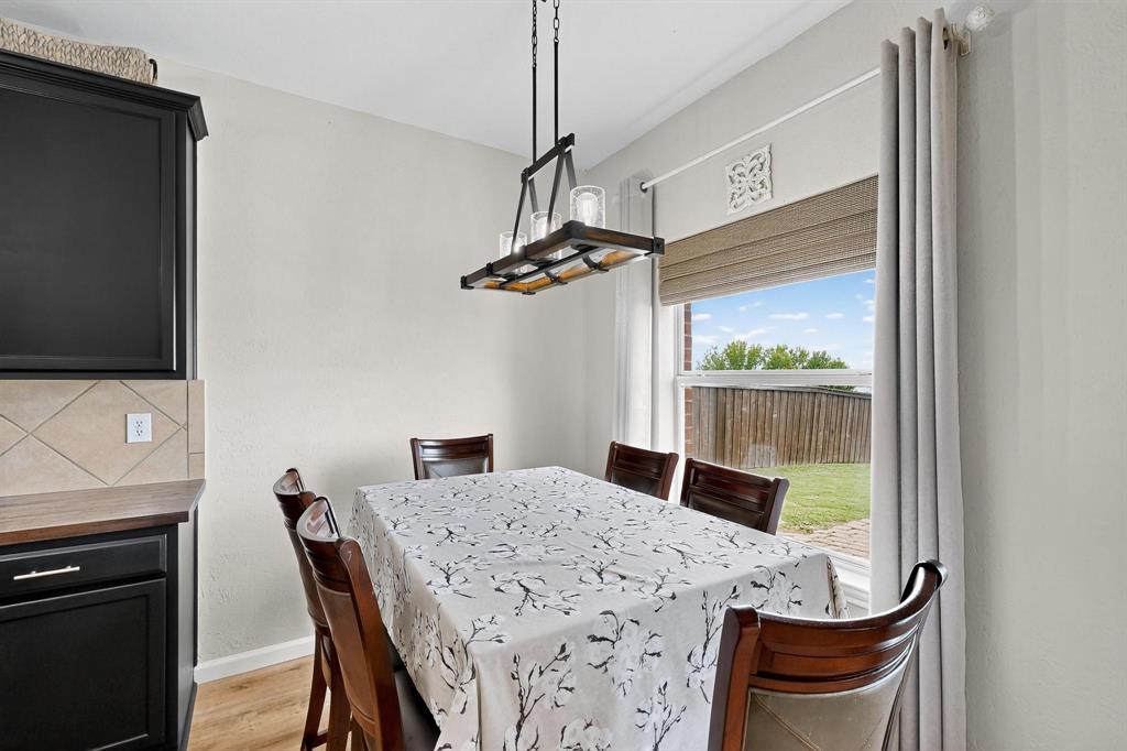 2820 Appaloosa Court Little Elm, TX 75068 - Photo 12 of 40 a view of a dining room with furniture window and outside view