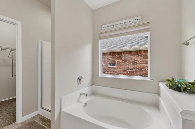 a bathroom with a granite countertop sink mirror and toilet