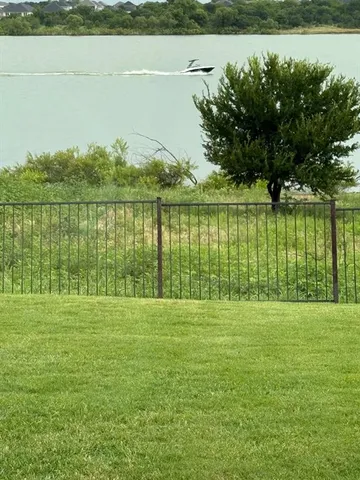 a view of a lake with a big yard