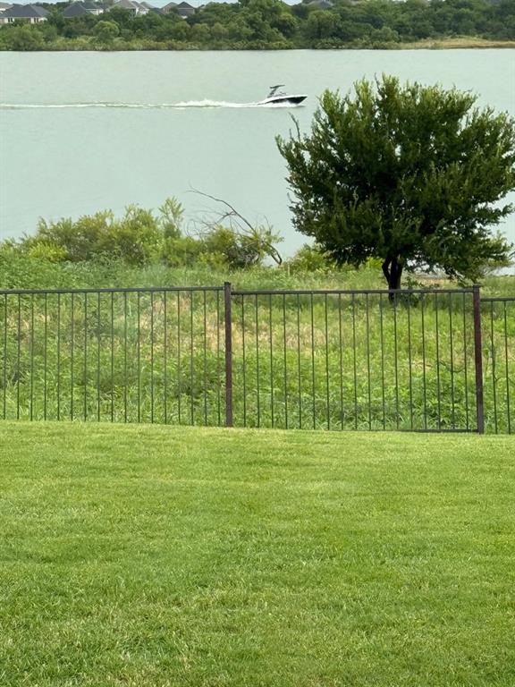 2820 Appaloosa Court Little Elm, TX 75068 - Photo 2 of 40 a view of a lake with a big yard