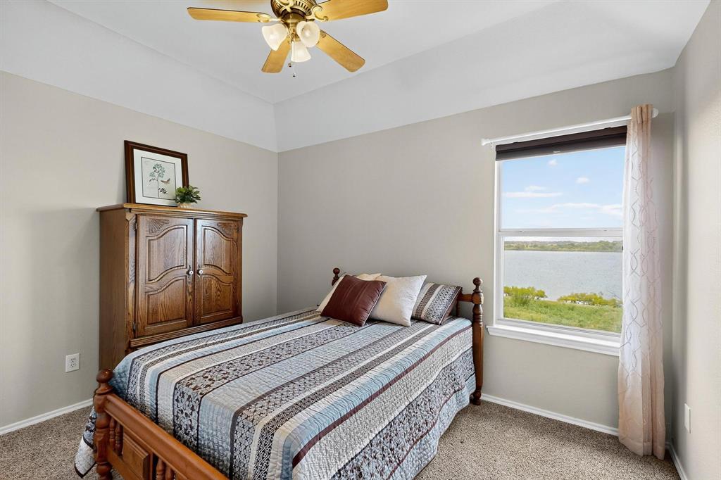 2820 Appaloosa Court Little Elm, TX 75068 - Photo 27 of 40 a bedroom with a bed and a window