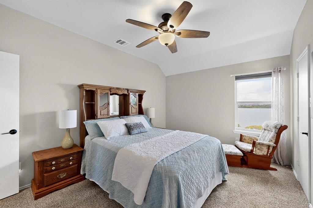 2820 Appaloosa Court Little Elm, TX 75068 - Photo 31 of 40 a bedroom with a bed gym equipment and a window