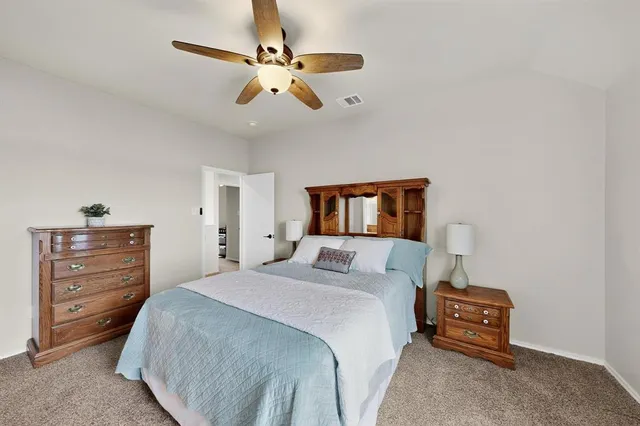 a bedroom with a bed gym equipment and a window