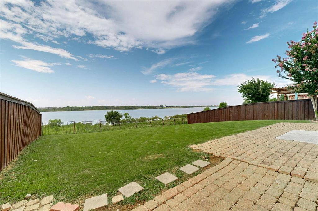 2820 Appaloosa Court Little Elm, TX 75068 - Photo 34 of 40 a view of a golf course with a garden