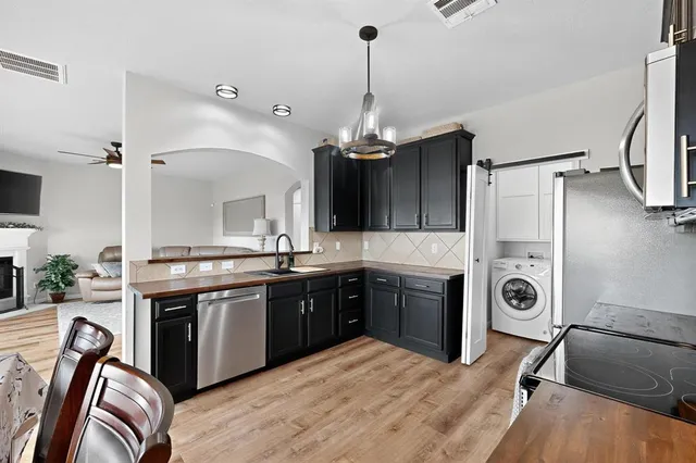 a living room with furniture and a rug