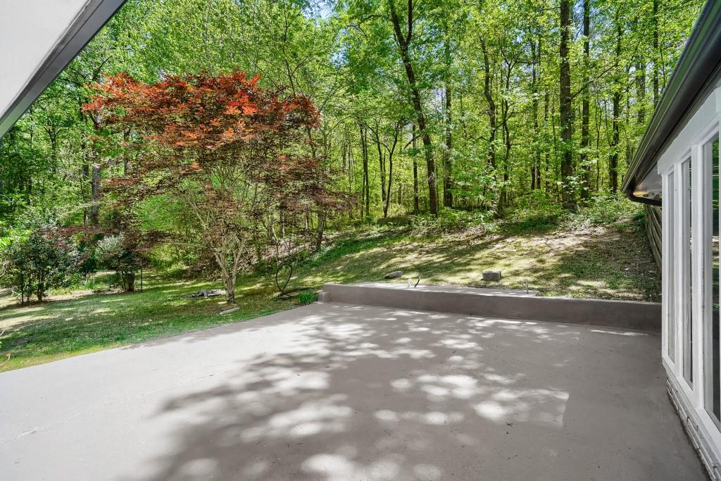 2021 Irwin Bridge Road Northwest Conyers, GA 30012 - Photo 42 of 43 a view of a yard with plants and large trees