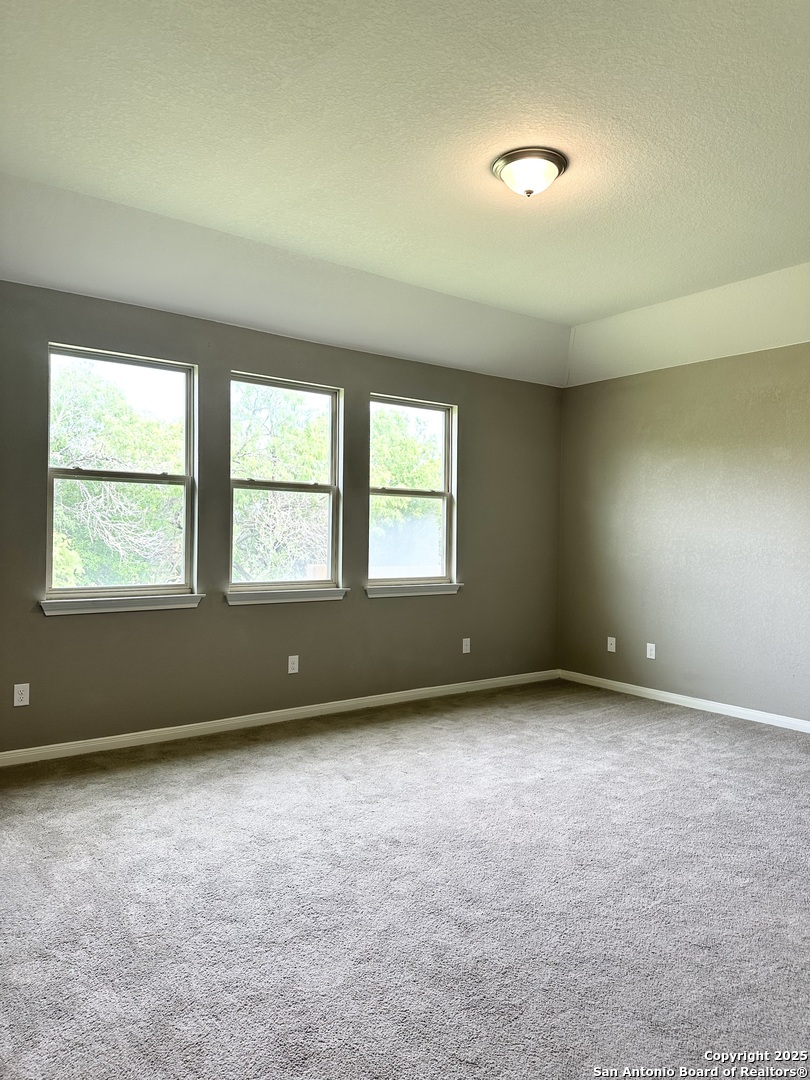 218 Iron Gate Pleasanton, TX 78064 - Photo 10 of 15 an empty room with a window