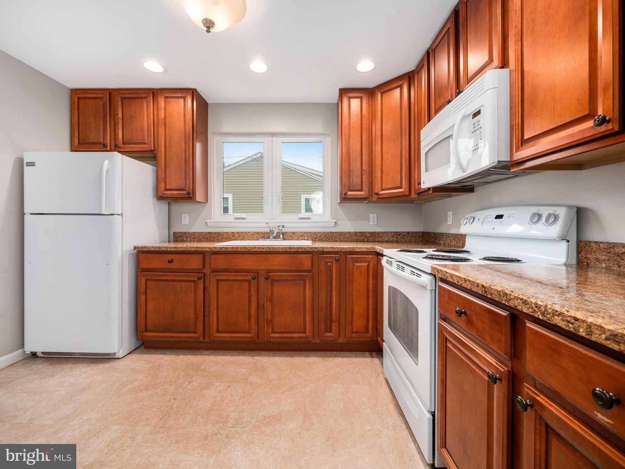 8 Rock Raymond Road Downingtown, PA 19335 - Photo 6 of 22 Modern kitchen with rich wood cabinetry.