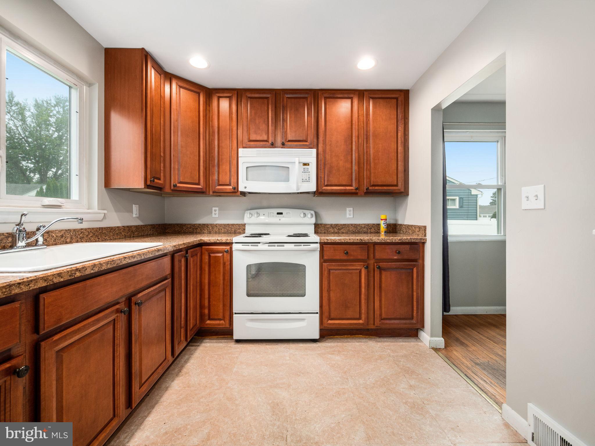 8 Rock Raymond Road Downingtown, PA 19335 - Photo 7 of 22 Modern kitchen with warm wood cabinetry.