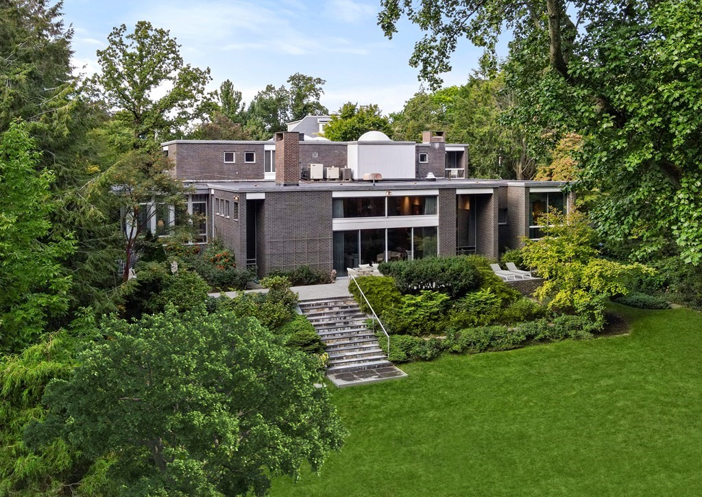 an aerial view of a house with a garden