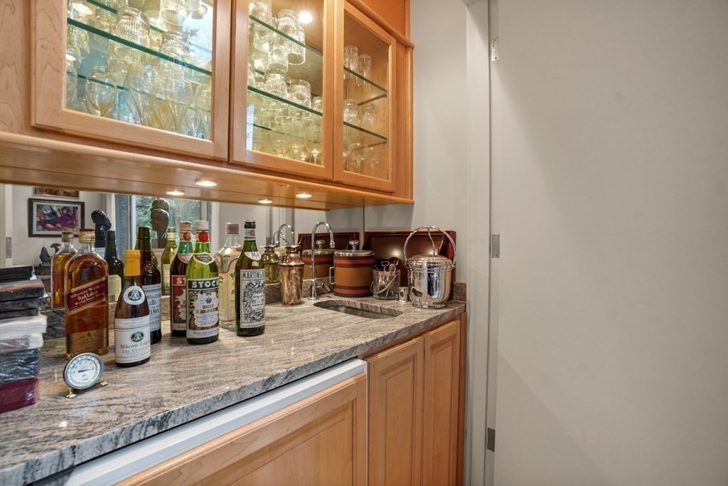 64 Highland Street Cambridge, MA 02138 - Photo 13 of 41 a kitchen with sink and mirror
